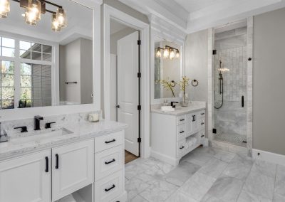 Beautiful bathroom in new luxury home with two vanities, sinks, and mirrors.