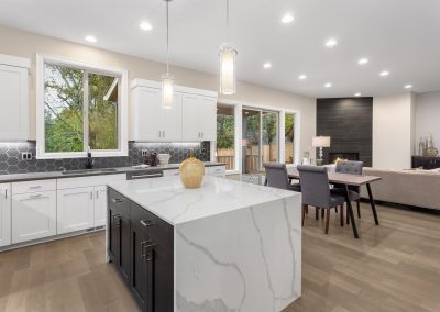 kitchen in luxury home with white marble countertops