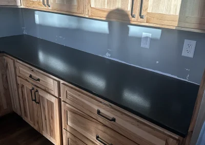 black stone countertops with light wood cabinets birchwood village