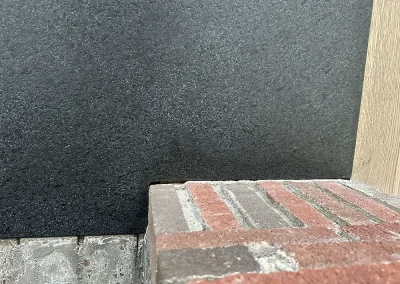 black stone fireplace hearth installation detail lakeland shores mn
