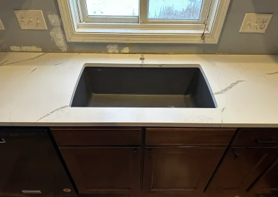 black undermount sink in white stone countertop forest wi