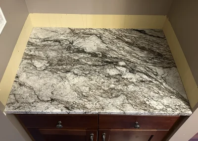 close up grey veined stone countertop surface baxter