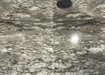 close up stone countertop seam with pop up outlet baxter