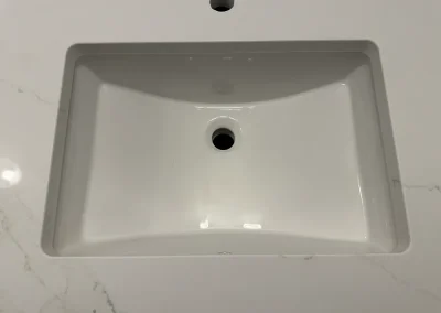 close up undermount sink in white quartz viking
