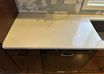 close up white veined stone countertop surface forest wi