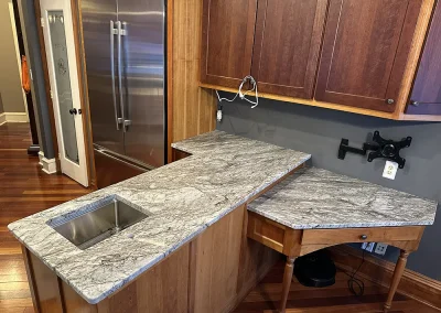 custom kitchen island with stone countertops and desk baxter