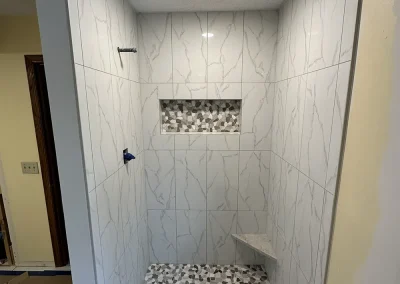 custom stone shower with pebble floor arcola mn