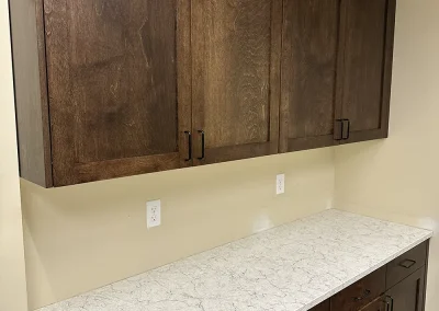 dark wood cabinets over white stone counter lexington