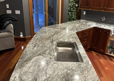 expansive grey stone kitchen island with sink baxter wi