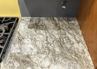 grey stone countertop next to gas stove baxter wi