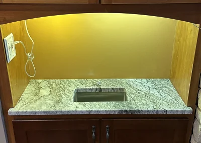 home bar stone countertops dark wood cabinets baxter wi