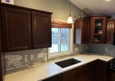 kitchen remodel white stone countertops dark cabinets forest wi