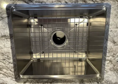 kraus stainless sink with grid in stone countertop baxter