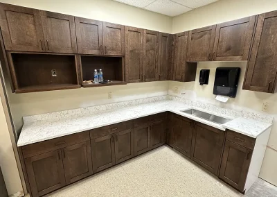 l shaped breakroom with white stone countertops lexington mn