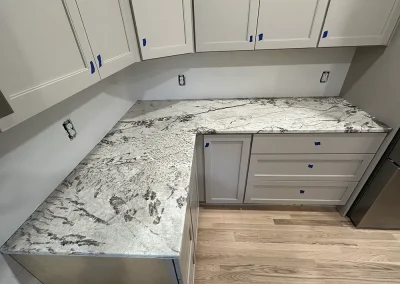l shaped grey stone countertops light cabinets pine springs mn