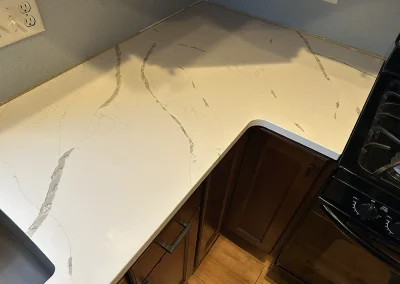 l shaped white stone countertop corner detail forest wi