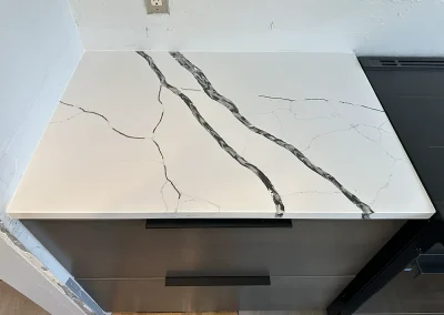 modern kitchen white stone counters dark cabinets withrow