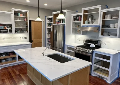 open concept kitchen white stone island trimbelle wi