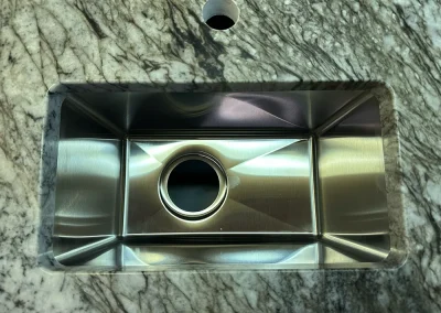 stainless steel undermount sink in stone countertop baxter
