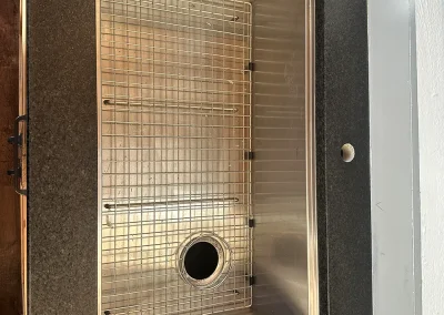stainless undermount sink in black stone countertop birchwood village mn