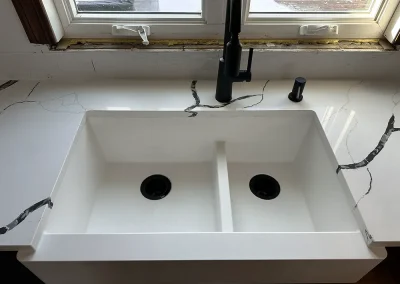 white farmhouse sink in quartz countertop withrow mn