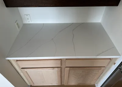 white quartz countertop light wood cabinets st marys point mn