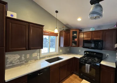 white stone kitchen counters with black appliances forest wisconsin